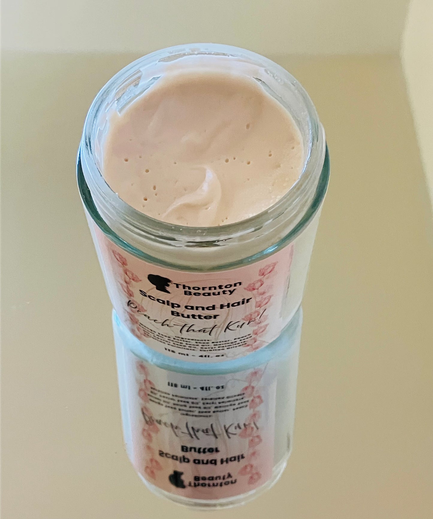 Jar of cream with a visible label on a light background